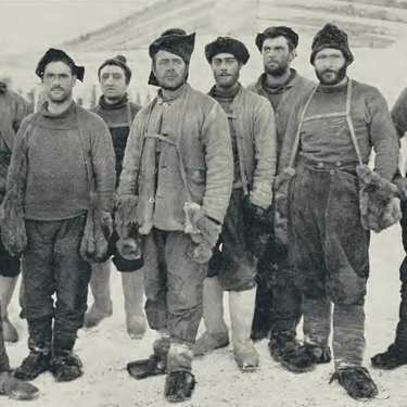 A group portrait of Captain Scott and his team wearing heavy cold-weather gear during their expedition to the South Pole.