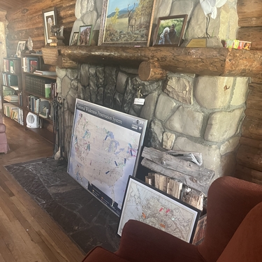 The stone fireplace inside the Murie Residence